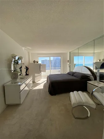 a bedroom with bed and window