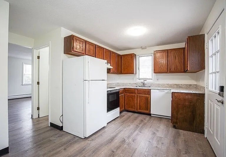 878-880 St James Avenue Springfield, MA 01104 - Photo 4 of 17 a kitchen with stainless steel appliances granite countertop a refrigerator sink and cabinets