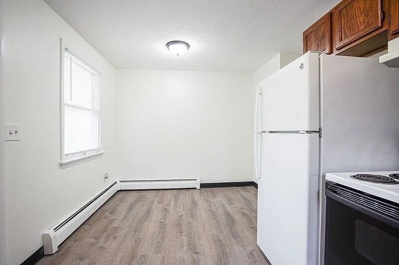 878-880 St James Avenue Springfield, MA 01104 - Photo 6 of 17 a view of a kitchen with a stove top oven