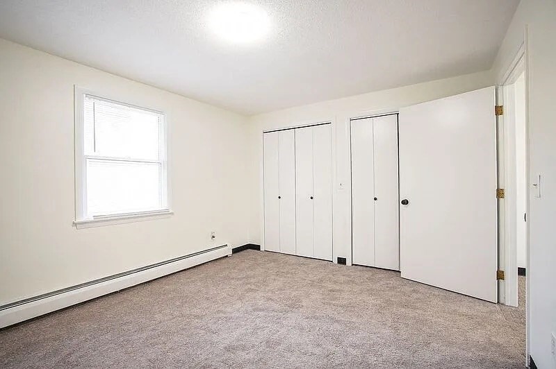 878-880 St James Avenue Springfield, MA 01104 - Photo 10 of 17 a view of an empty room with a window