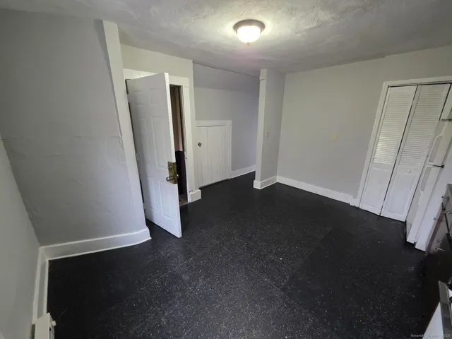 an empty room with a fireplace