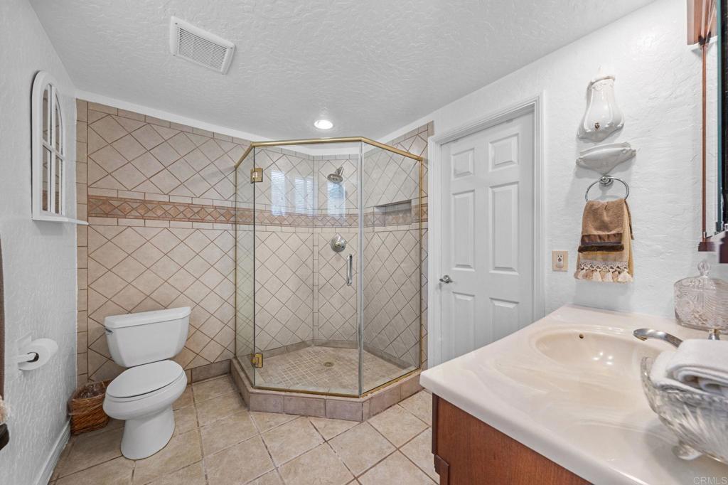 30265 Miller Road Valley Center, CA 92082 - Photo 22 of 56 a bathroom with a toilet sink and shower