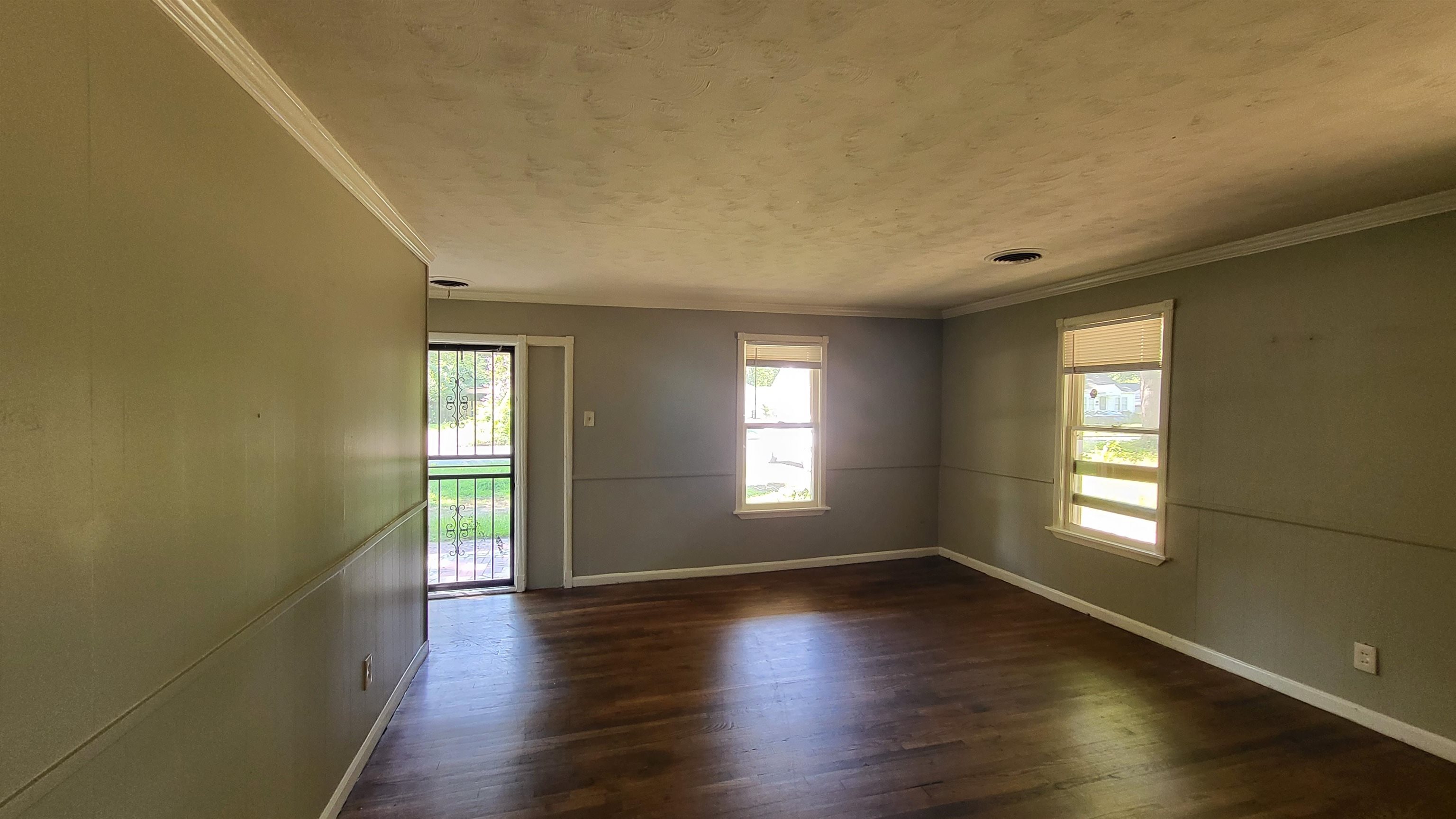 3758 Elliston Road Memphis, TN 38111 - Photo 3 of 6 Empty room featuring dark hardwood / wood-style flooring and ornamental molding