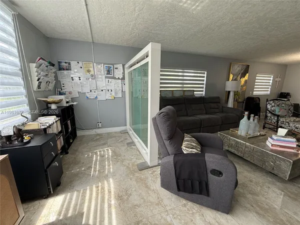 a view of living room and hardwood floor