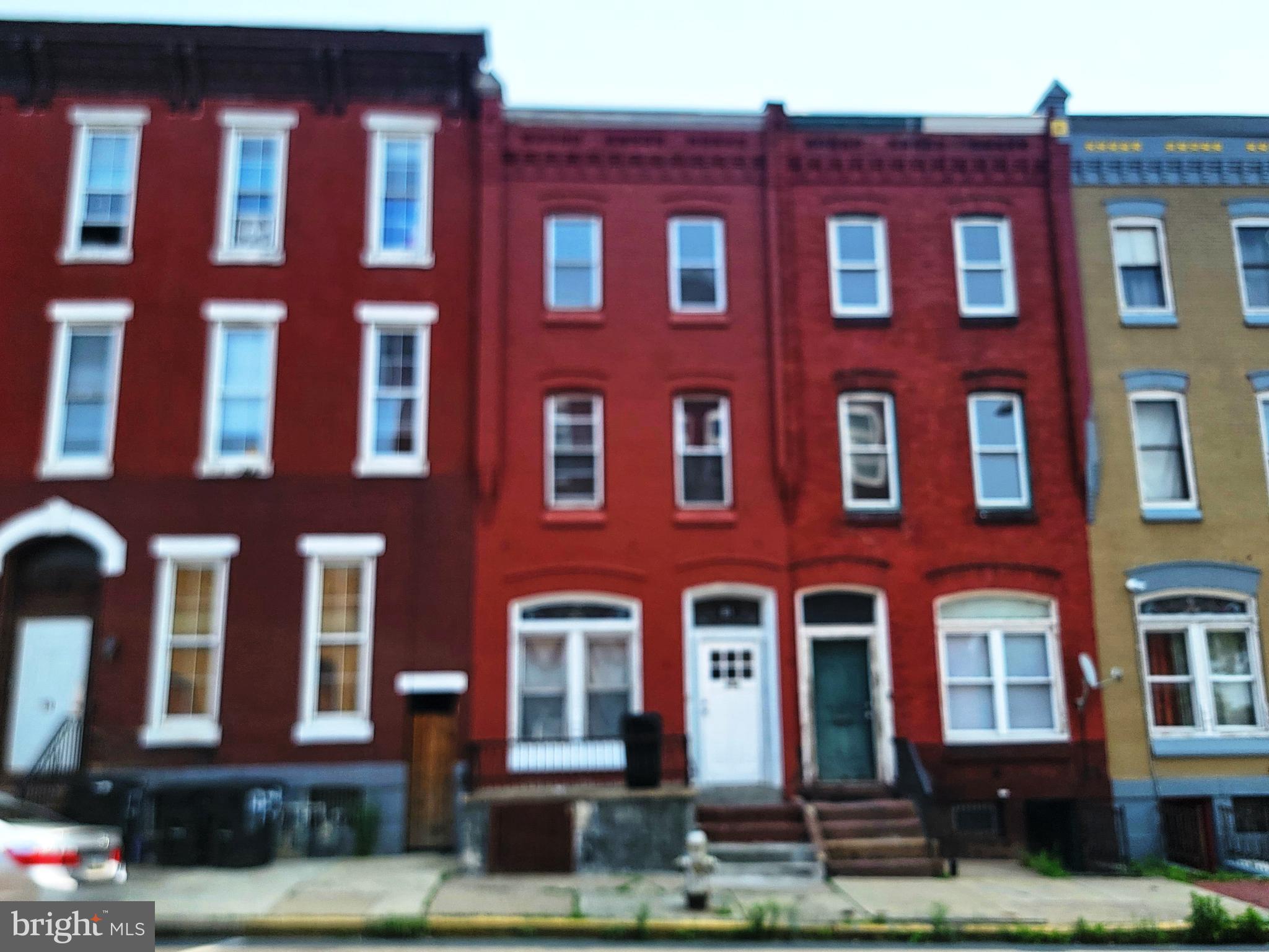 a red brick building that has lot of windows on it