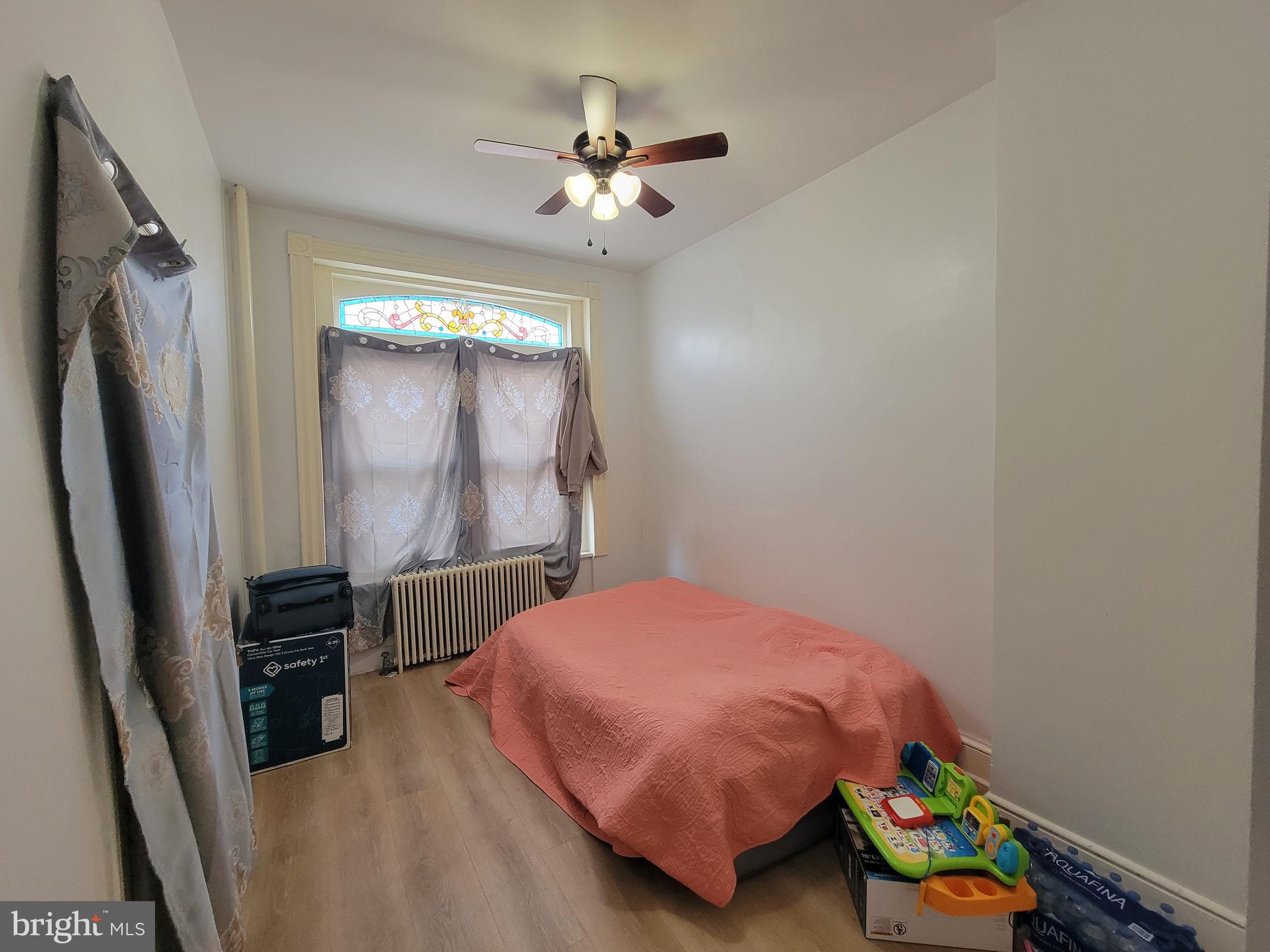 21 South 3rd Street Reading, PA 19602 - Photo 4 of 20 a bedroom with a bed dresser and a window
