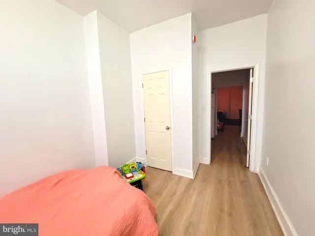 a bedroom with a bed and a table