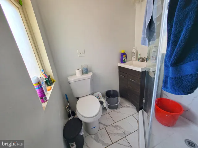 a bathroom with a toilet and a sink