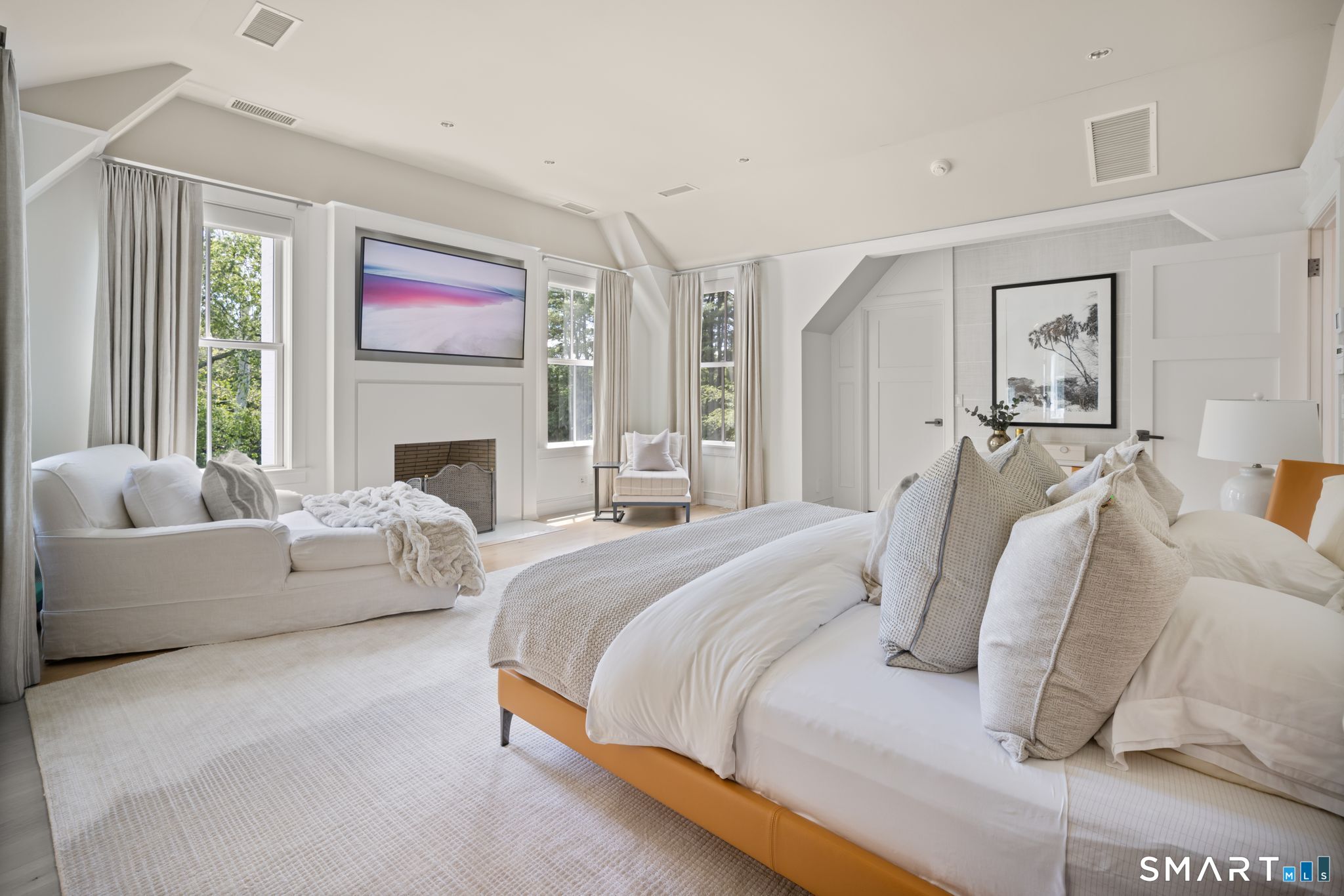 5 West Branch Road Weston, CT 06883 - Photo 22 of 40 a spacious bedroom with bed and a couch