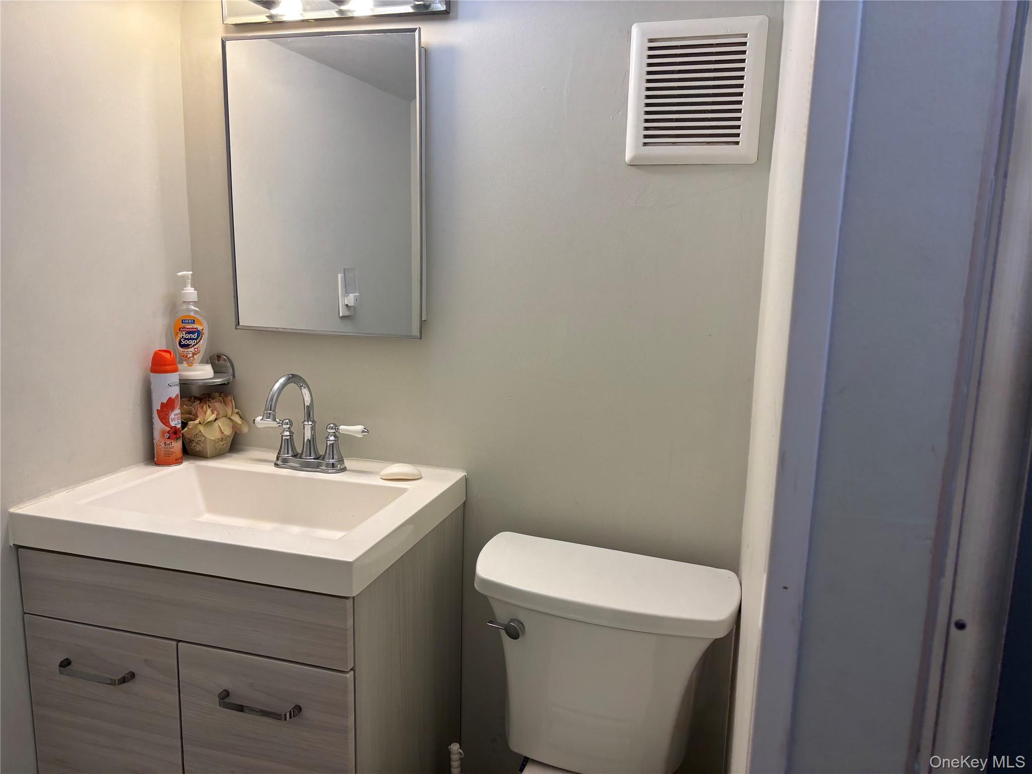 104-18 216th Street Queens, NY 11429 - Photo 22 of 49 Bathroom with vanity and toilet