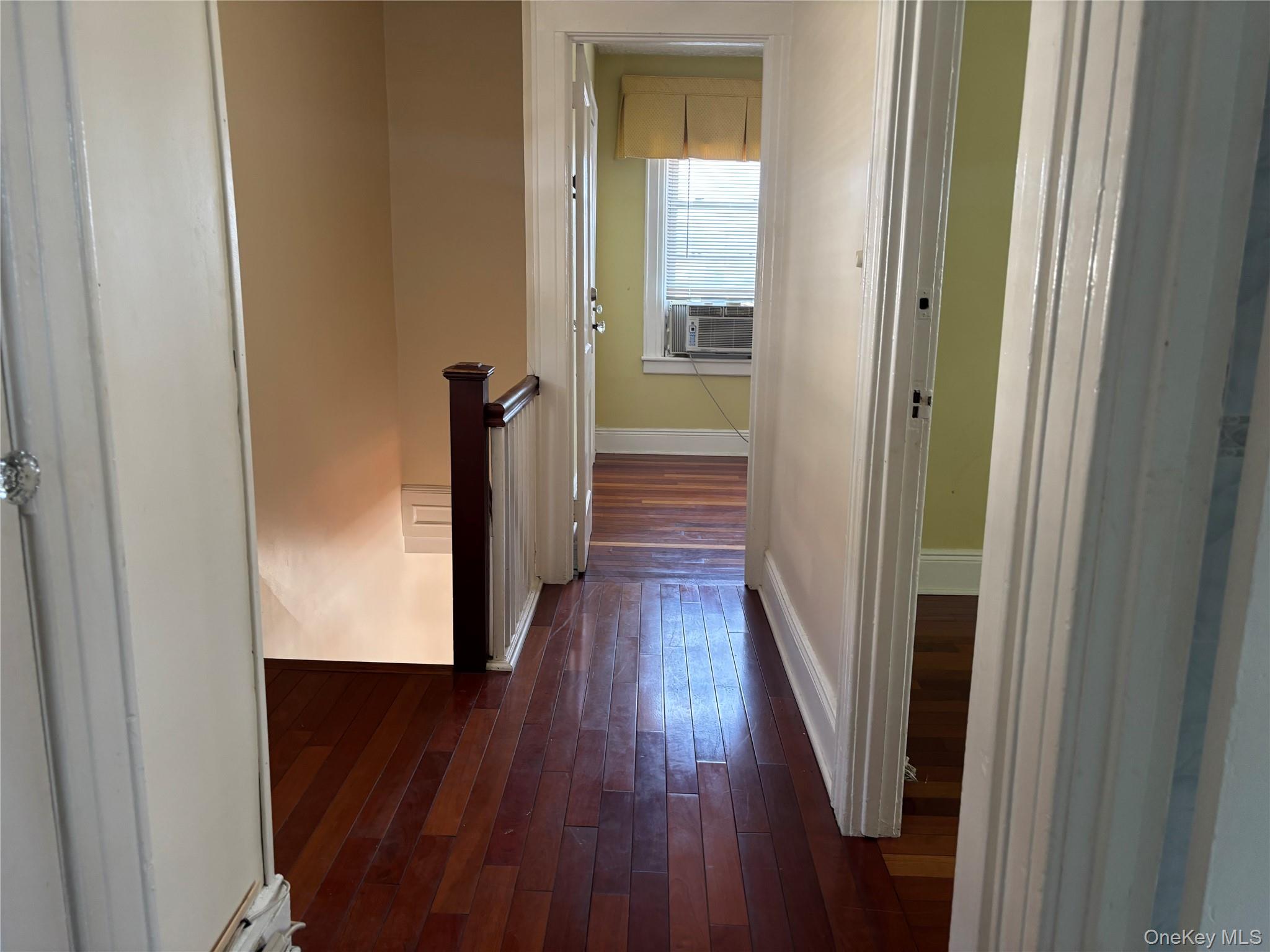 104-18 216th Street Queens, NY 11429 - Photo 32 of 49 Hall featuring dark wood-style flooring and an upstairs landing