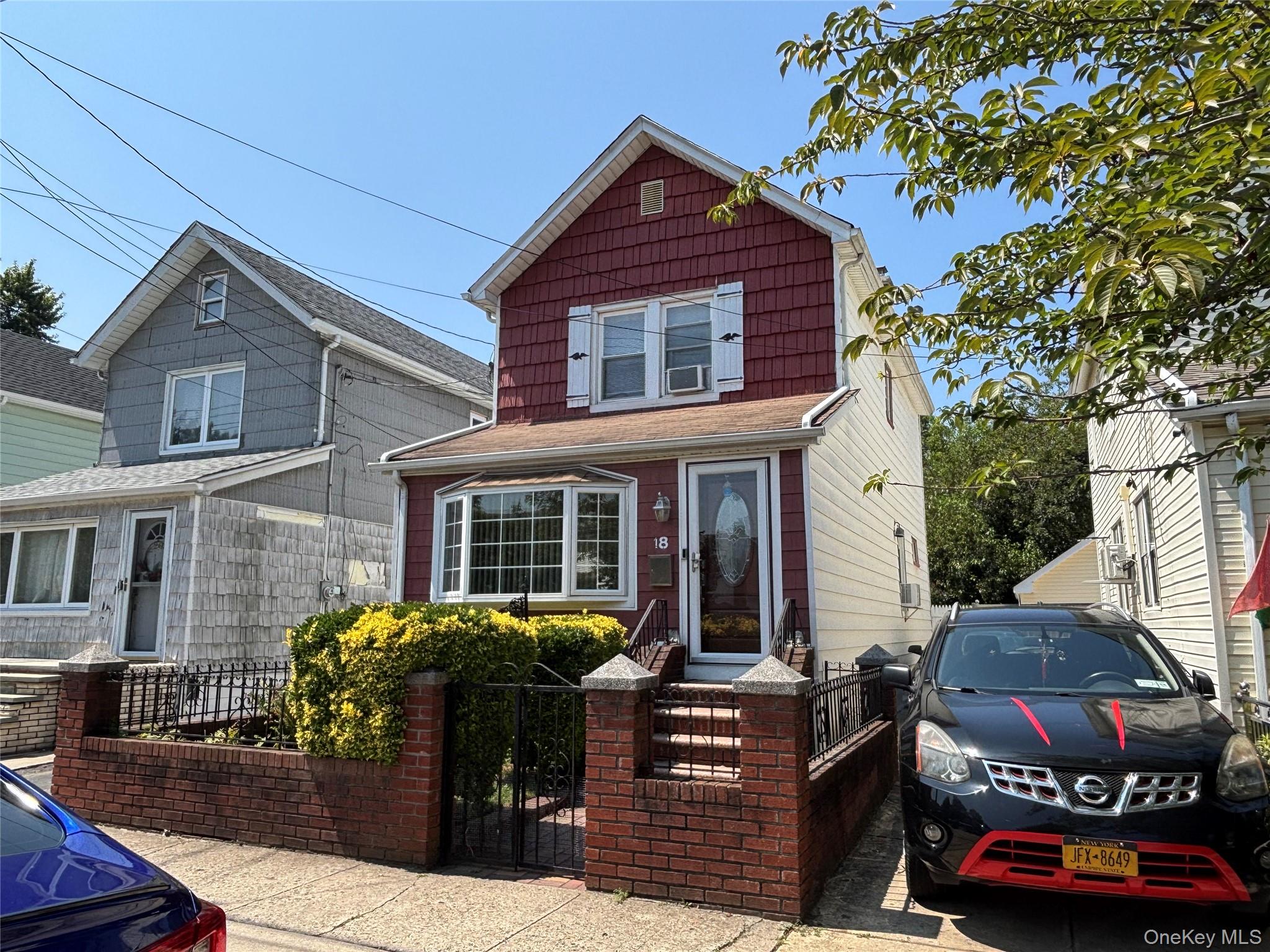 104-18 216th Street Queens, NY 11429 - Photo 4 of 49 View of front of house featuring a gate and a fenced front yard