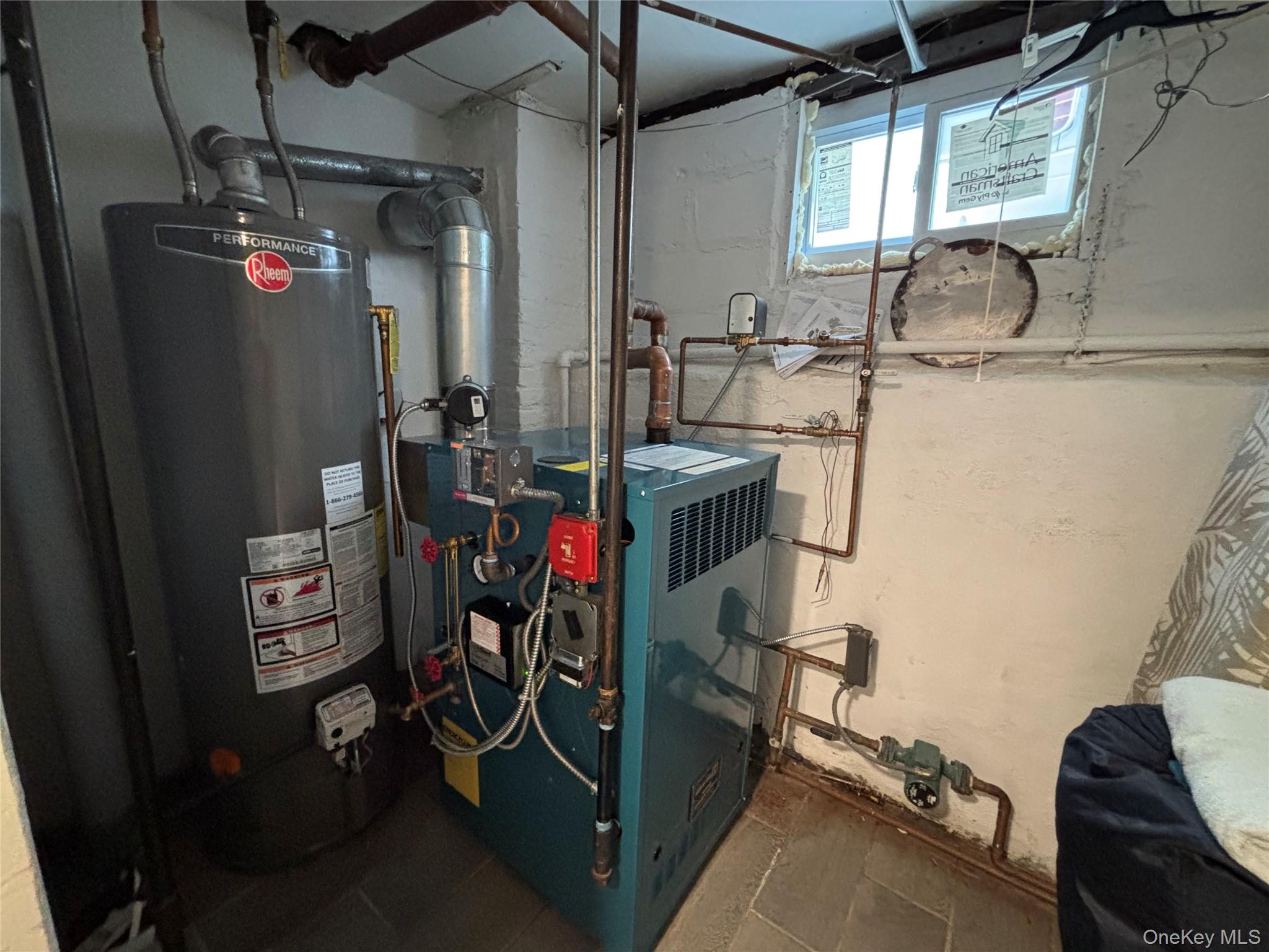 104-18 216th Street Queens, NY 11429 - Photo 42 of 49 Utilities featuring water heater and a heating unit