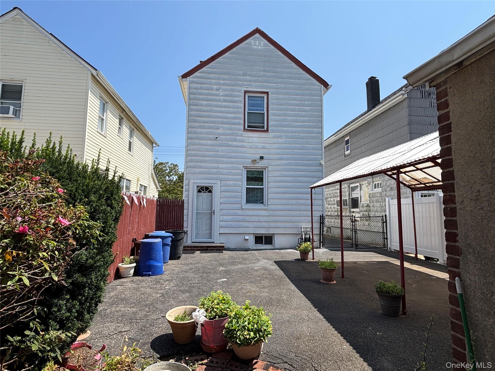 104-18 216th Street Queens, NY 11429 - Photo 44 of 49 Rear view of property with a patio and a gazebo
