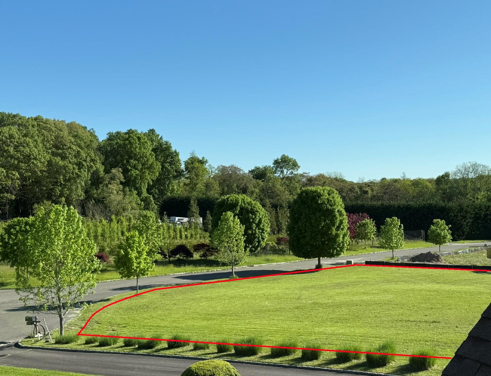 a view of a swimming pool with a yard