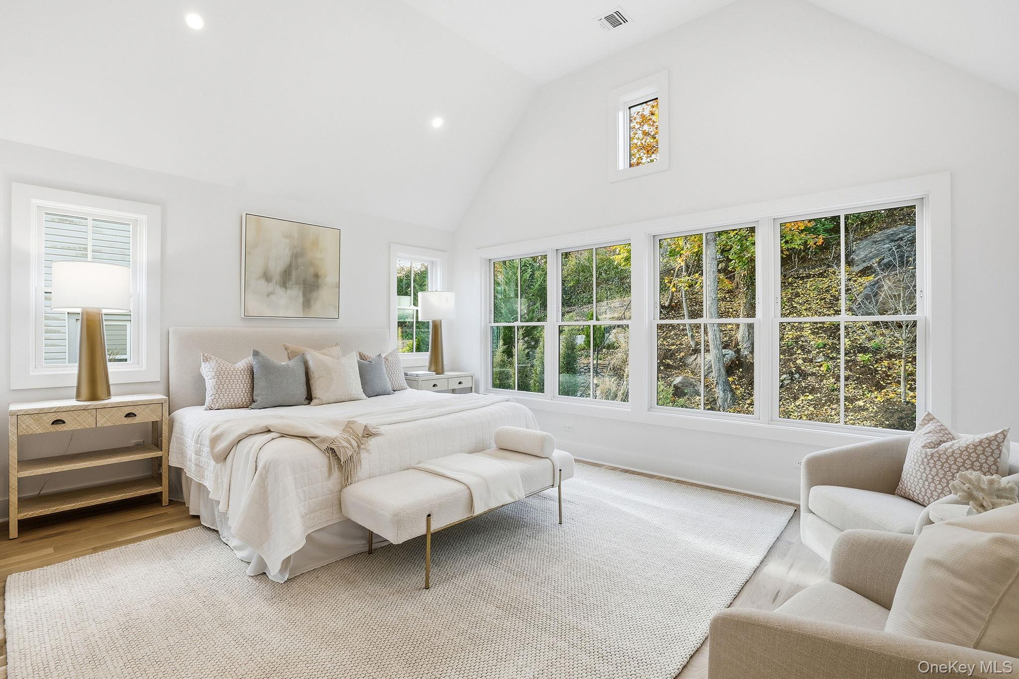80 Grapal Street Rye, NY 10580 - Photo 17 of 38 a spacious bedroom with a bed and glass window