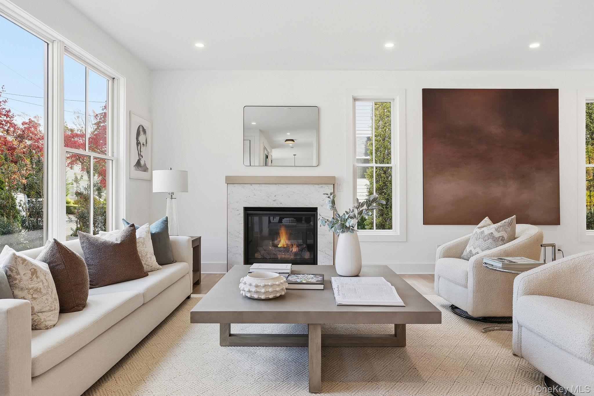 80 Grapal Street Rye, NY 10580 - Photo 2 of 38 a living room with furniture a large window and a fireplace