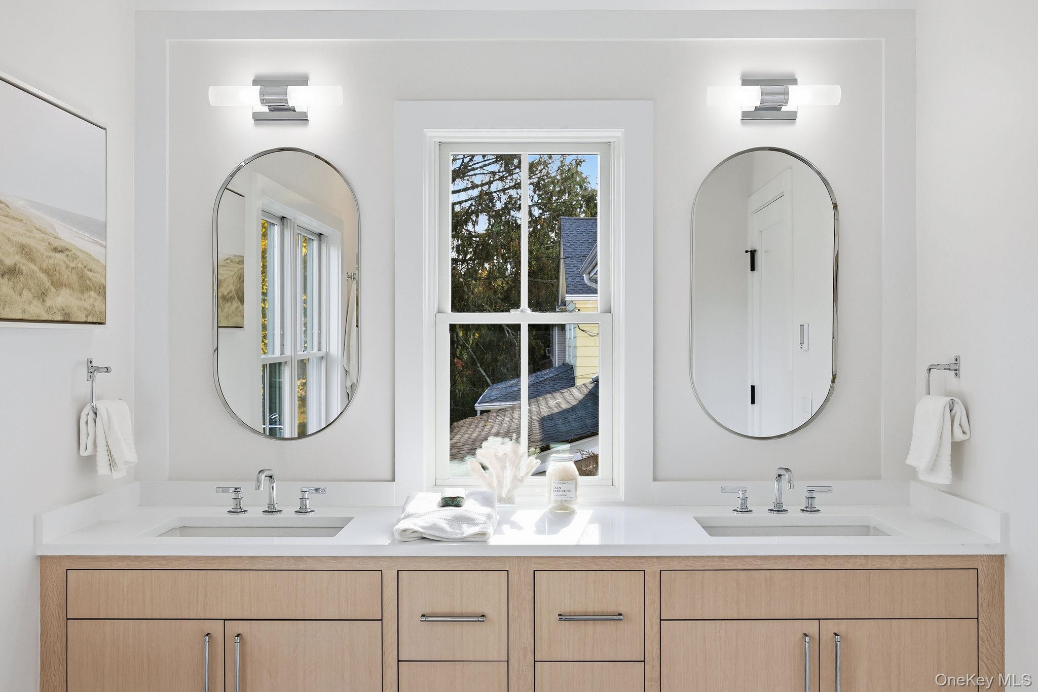 80 Grapal Street Rye, NY 10580 - Photo 21 of 38 a bathroom with double vanity sinks and a mirror