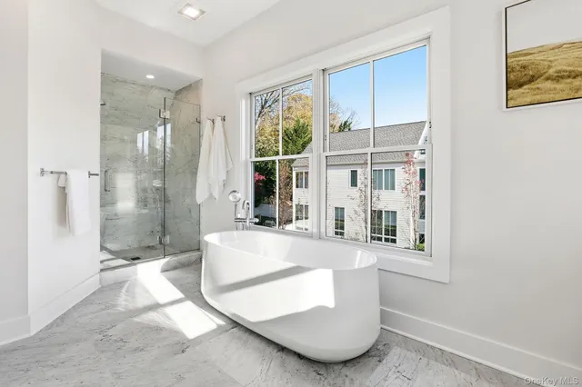 a bathroom with double vanity sinks and a mirror