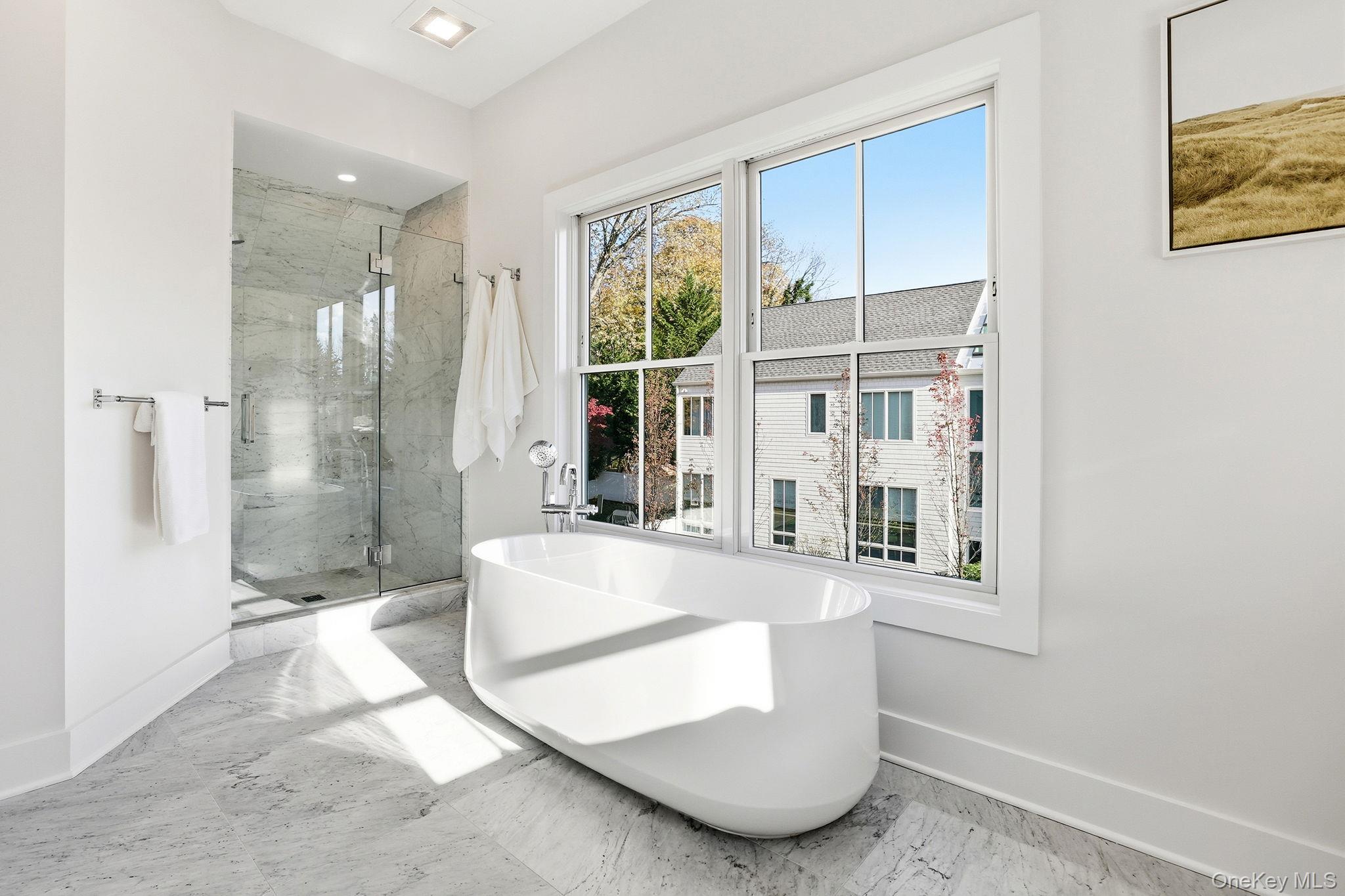 80 Grapal Street Rye, NY 10580 - Photo 22 of 38 a large white tub sitting in front of a window