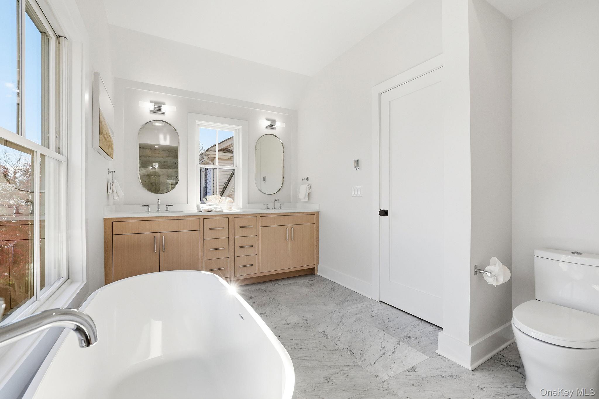 80 Grapal Street Rye, NY 10580 - Photo 23 of 38 a bathroom with a sink a toilet and mirror