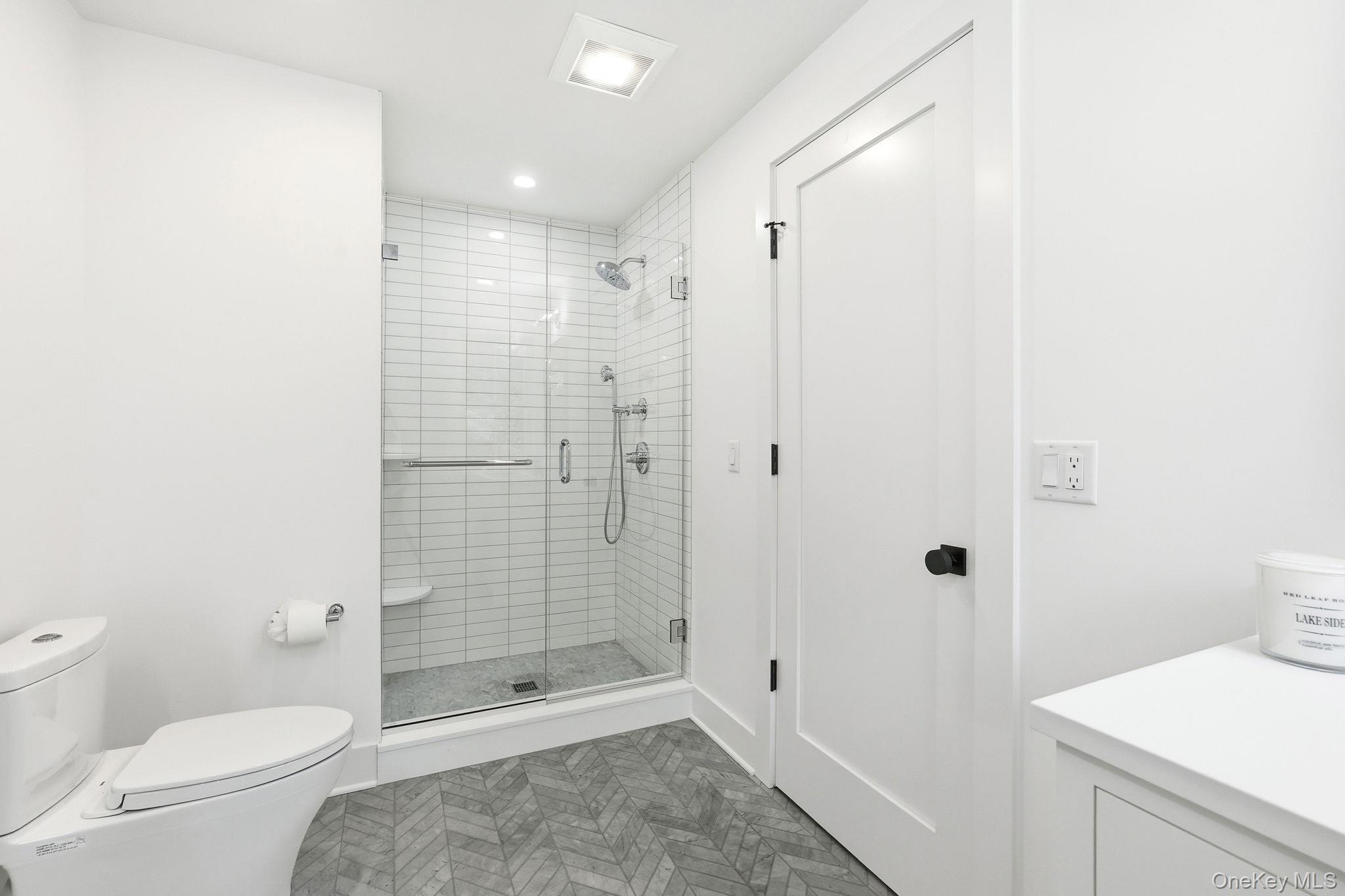 80 Grapal Street Rye, NY 10580 - Photo 28 of 38 a bathroom with a shower a toilet and a sink