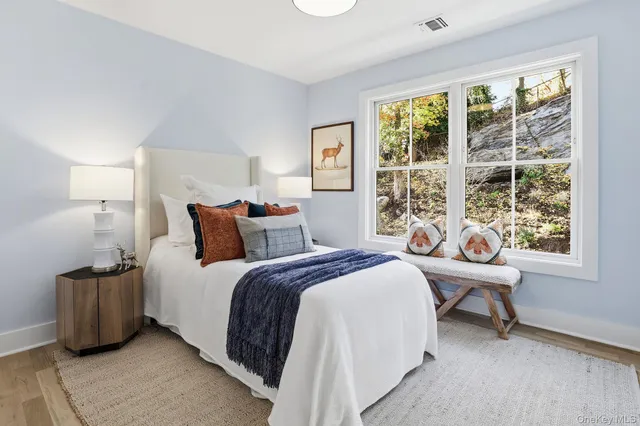 a bathroom with a shower a toilet and a sink