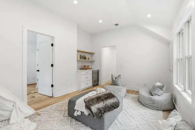 a bed room with a bed and a window