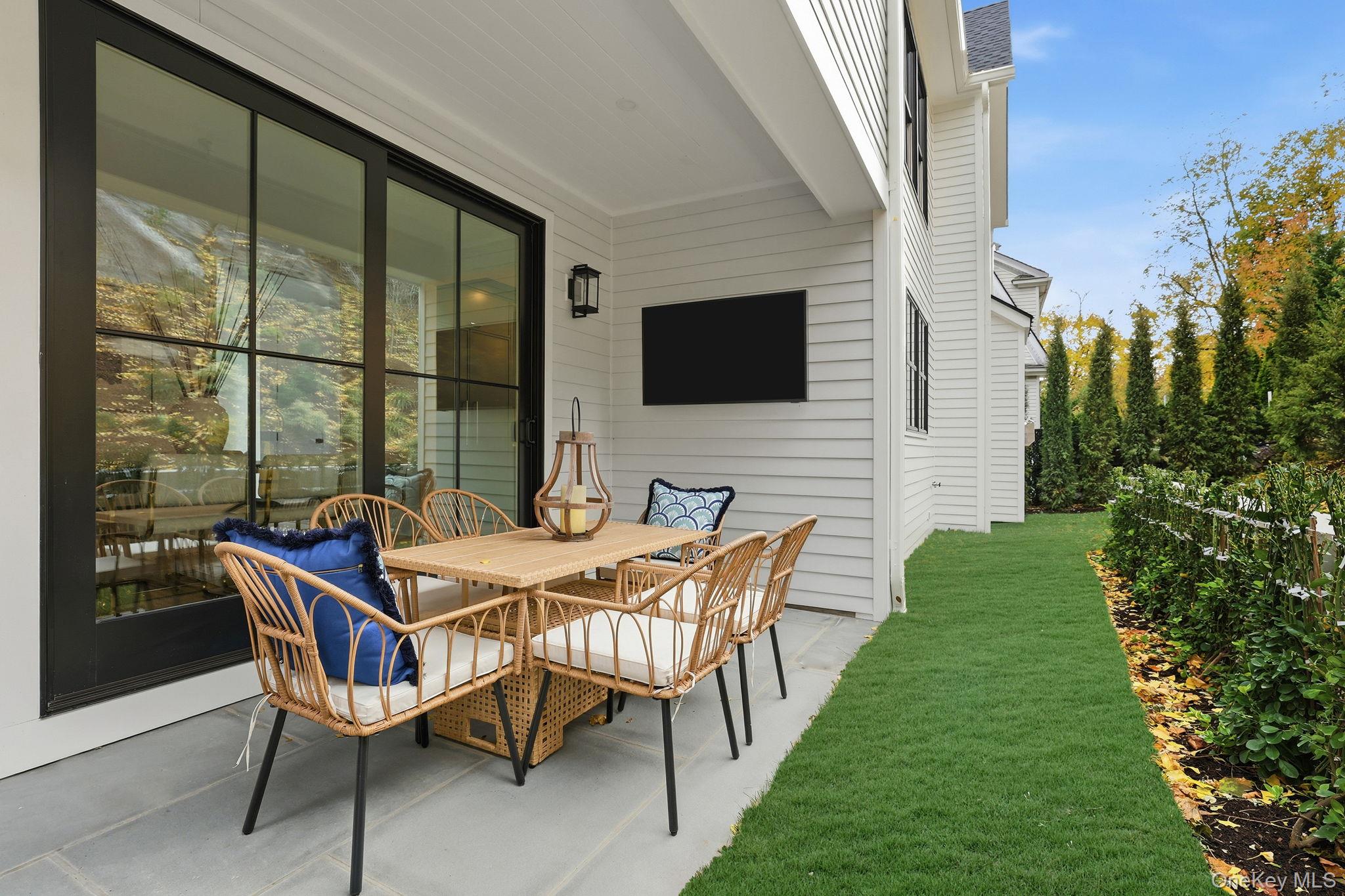 80 Grapal Street Rye, NY 10580 - Photo 37 of 38 a backyard of a house with table and chairs