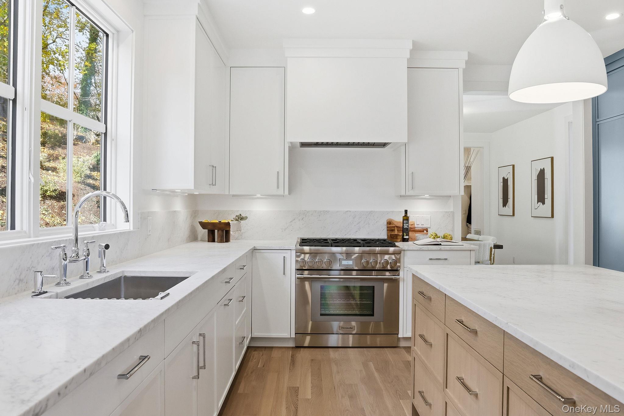 80 Grapal Street Rye, NY 10580 - Photo 9 of 38 a kitchen with a sink stove and cabinets