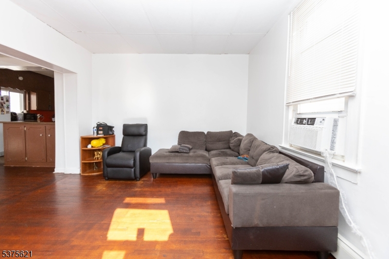 622 North 9th Street Newark, NJ 07107 - Photo 3 of 24 a living room with furniture and a couch