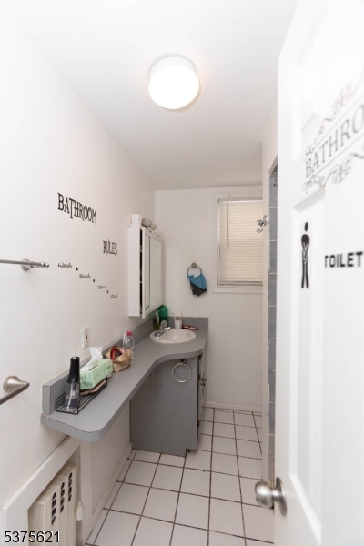 622 North 9th Street Newark, NJ 07107 - Photo 8 of 24 a kitchen with stainless steel appliances a refrigerator and a stove