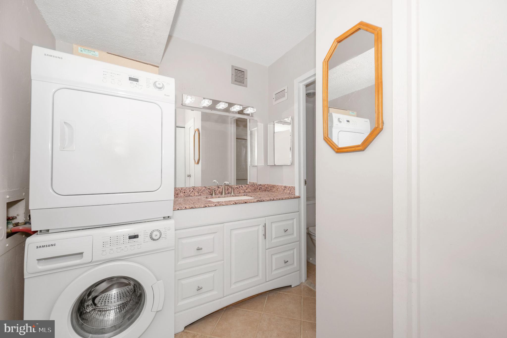 6800 Fleetwood Road, Unit 509 McLean, VA 22101 - Photo 23 of 48 a bathroom with a sink a vanity and a mirror