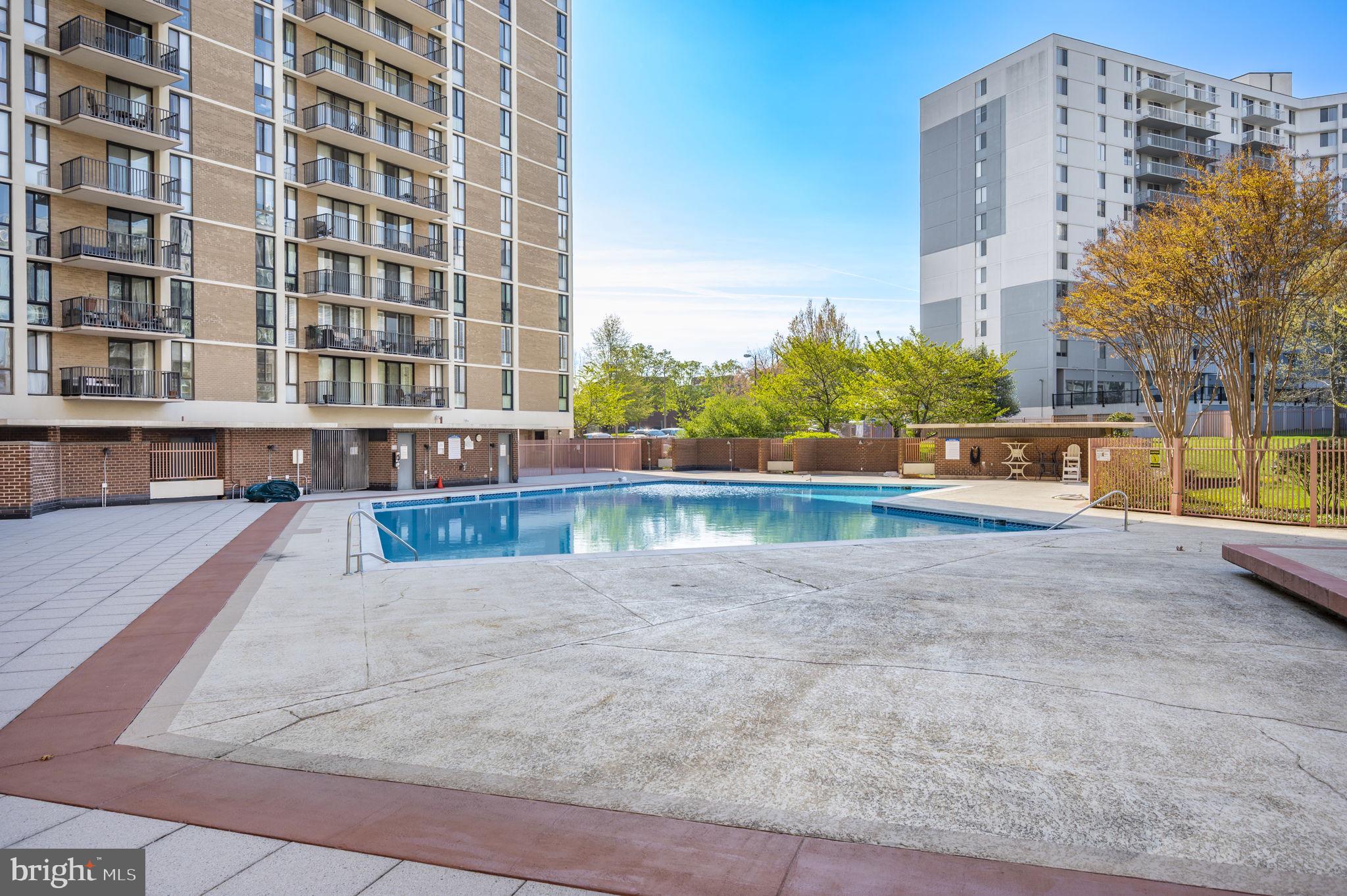 6800 Fleetwood Road, Unit 509 McLean, VA 22101 - Photo 34 of 48 a view of building with swimming pool