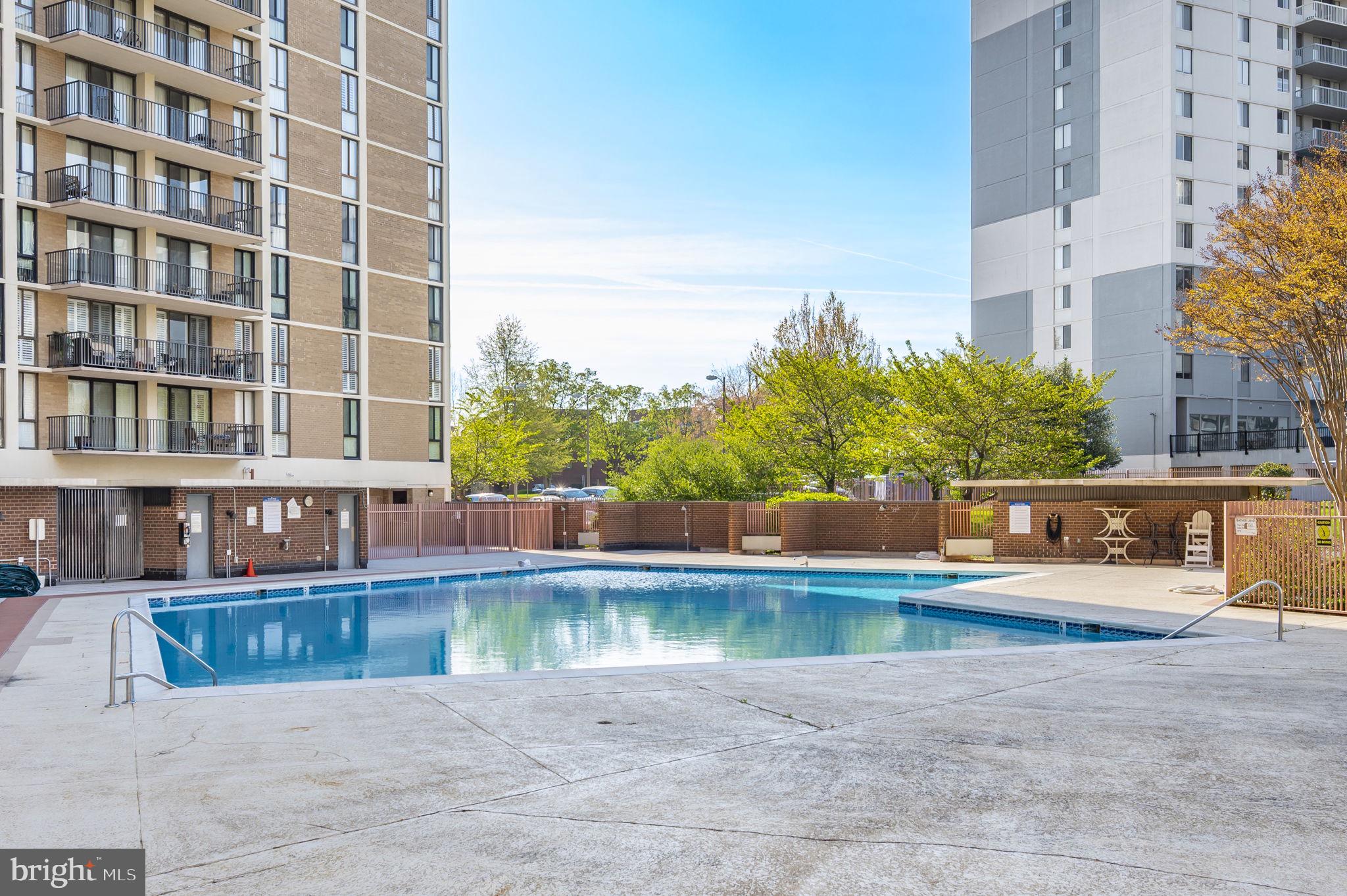 6800 Fleetwood Road, Unit 509 McLean, VA 22101 - Photo 35 of 48 a view of a swimming pool with a lake view