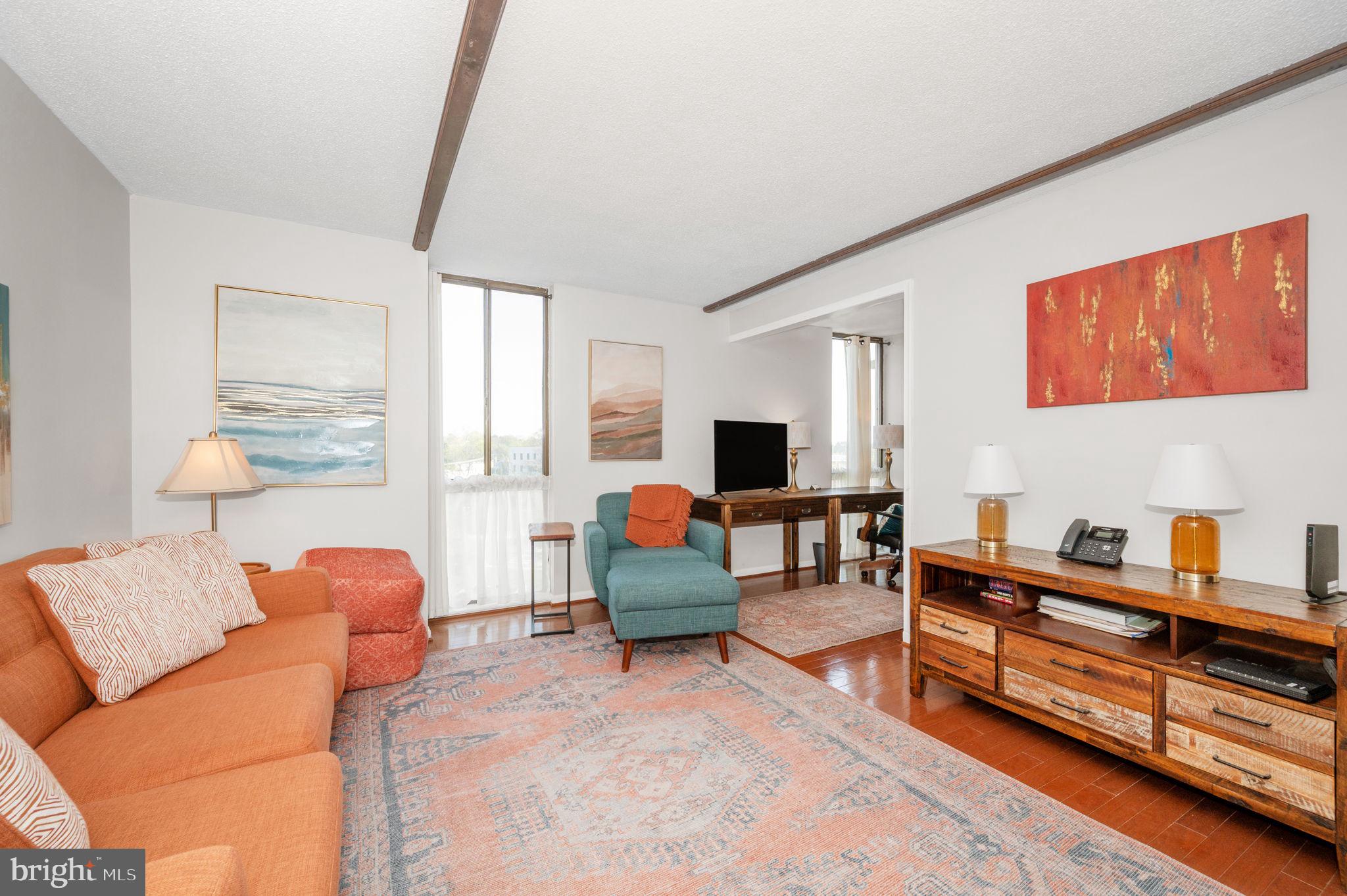 6800 Fleetwood Road, Unit 509 McLean, VA 22101 - Photo 10 of 48 a living room with furniture and a wooden floor