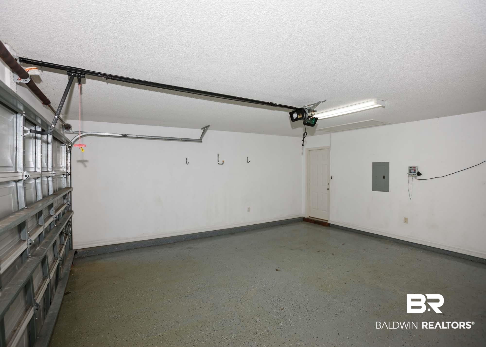 2530 Ashburn Lane Foley, AL 36535 - Photo 45 of 46 Garage featuring electric panel and a garage door opener