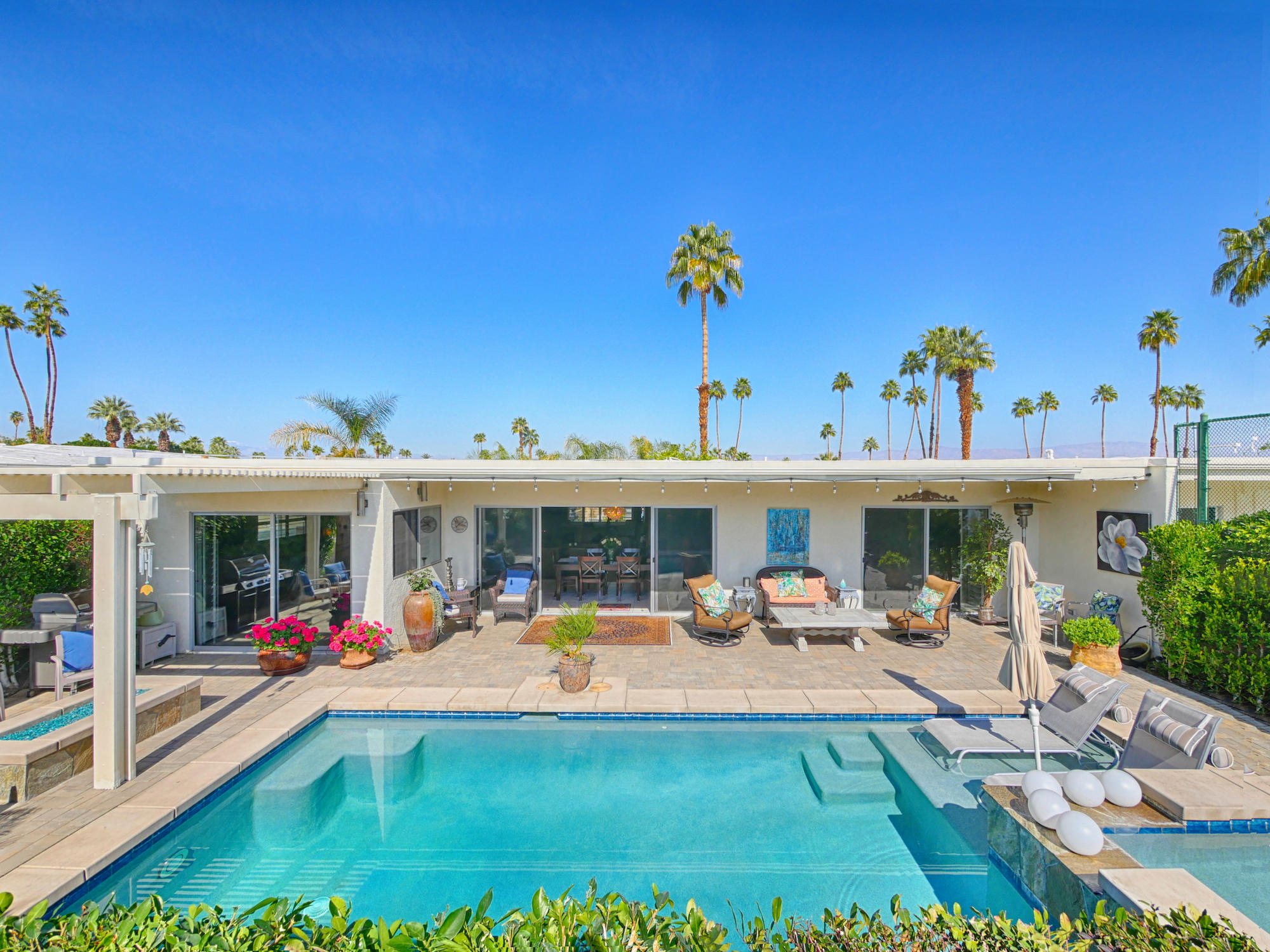 73597 18th Fairway Lane, Unit C Palm Desert, CA 92260 - Photo 1 of 42 a view of swimming pool with outdoor seating