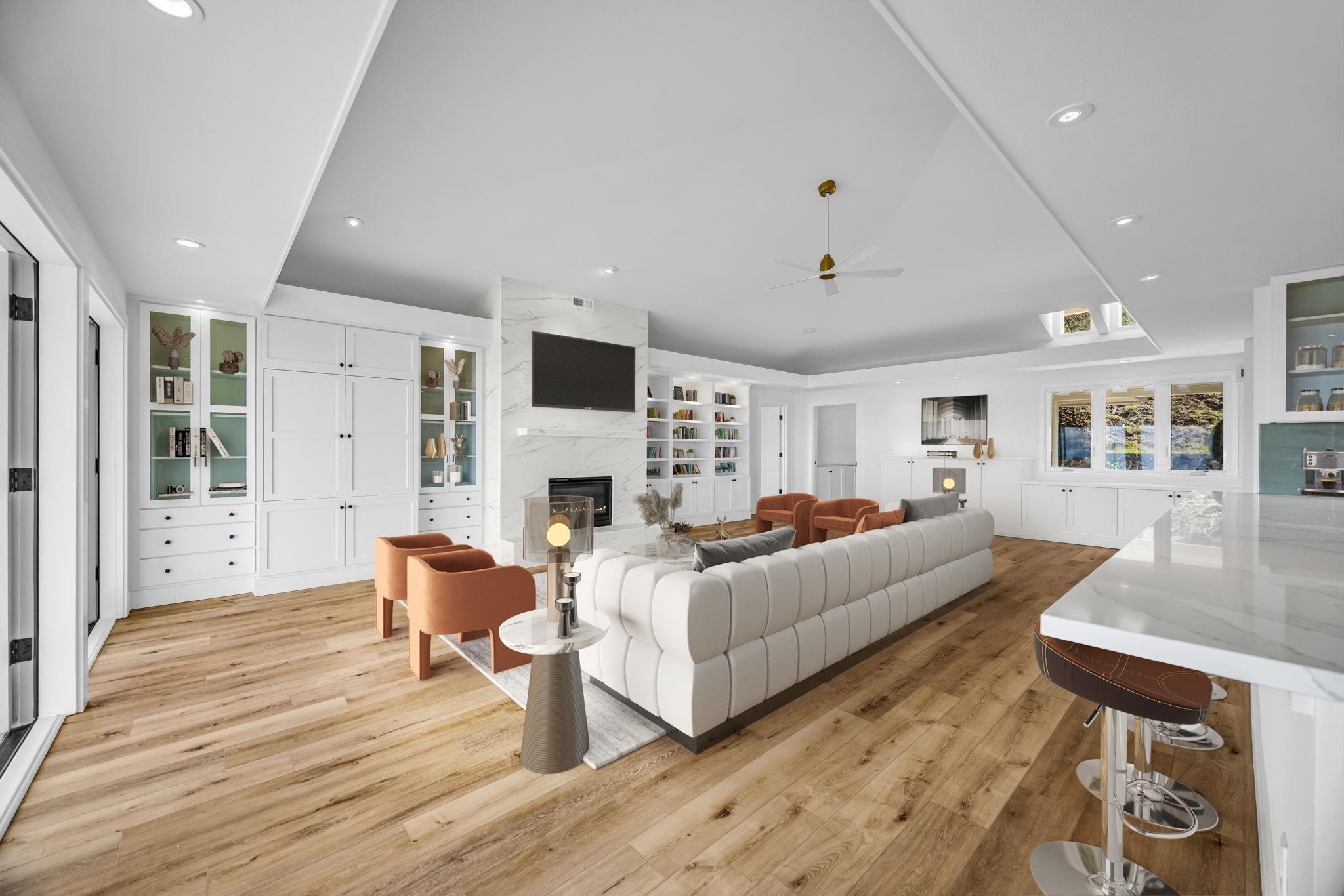 7733 Kula Highway Kula, HI 96790 - Photo 13 of 43 a living room with furniture a fireplace and a flat screen tv