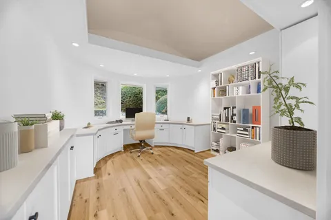 a view of cabinets and wooden floor