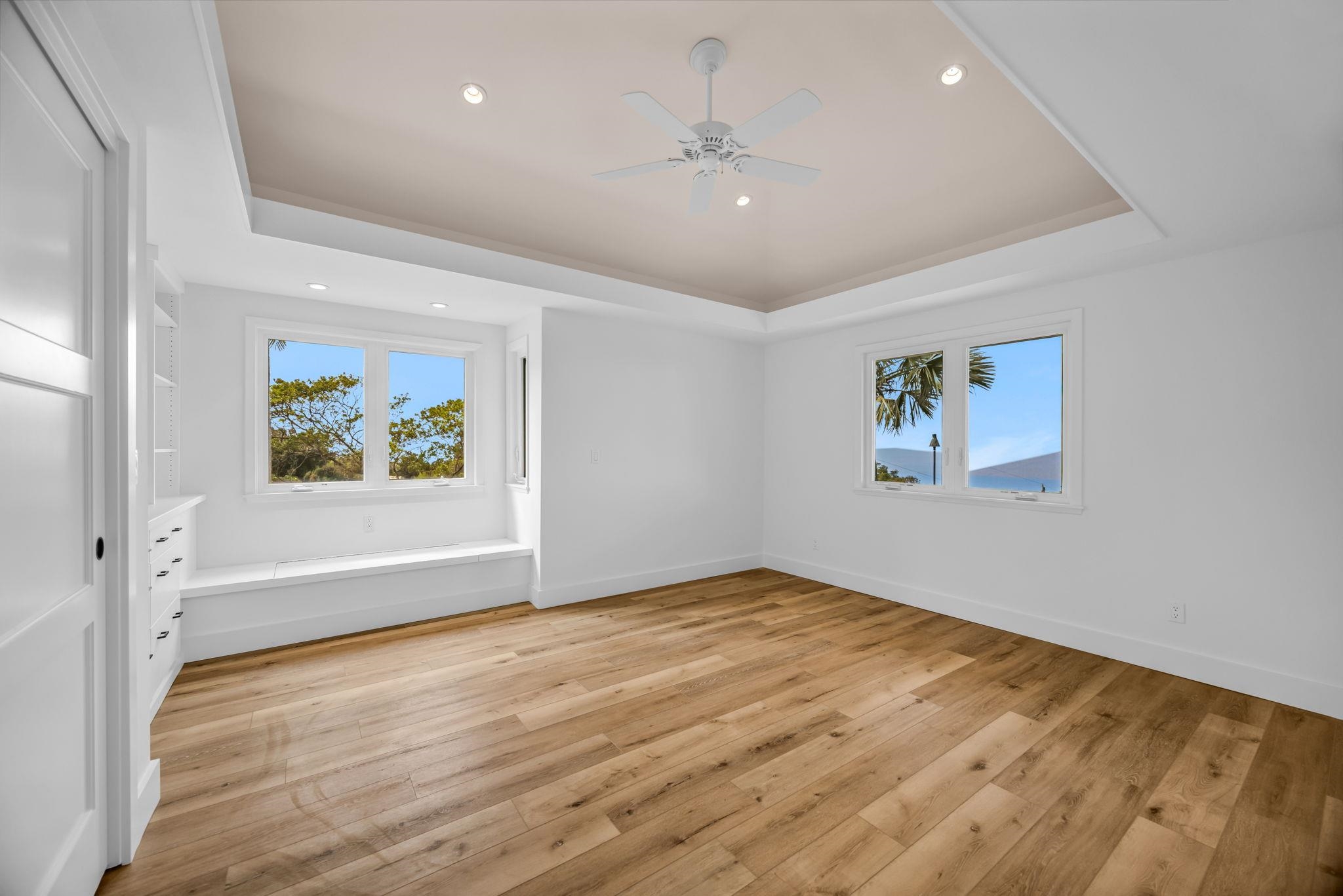 7733 Kula Highway Kula, HI 96790 - Photo 31 of 43 an empty room with wooden floor and window