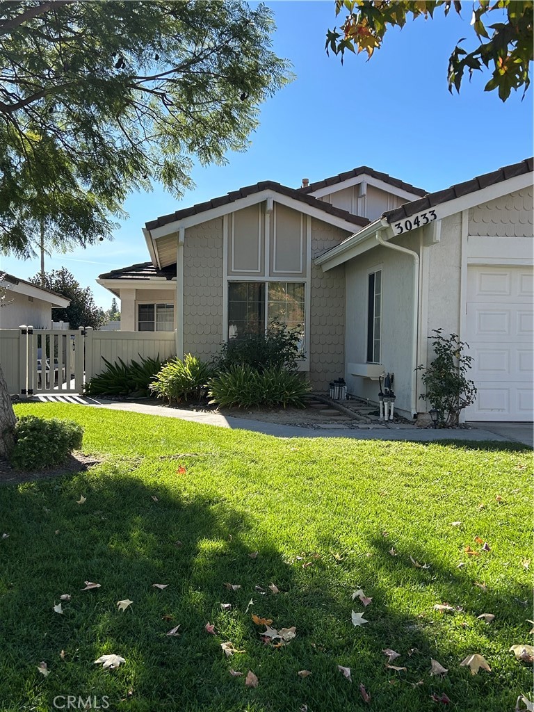 30433 Danube Court Temecula, CA 92591 - Photo 2 of 12 a front view of a house with garden