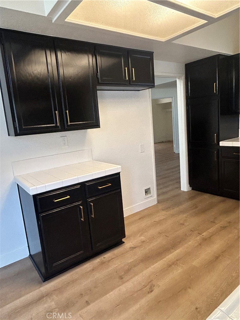30433 Danube Court Temecula, CA 92591 - Photo 8 of 12 a kitchen with stainless steel appliances granite countertop a refrigerator and a sink