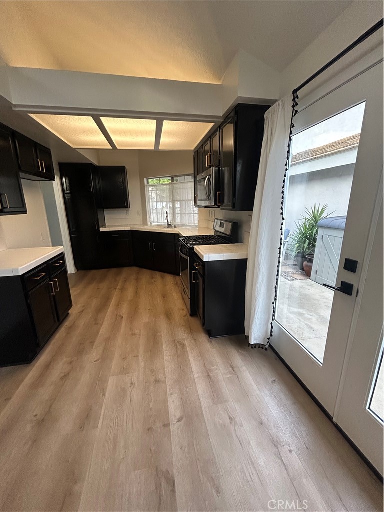 30433 Danube Court Temecula, CA 92591 - Photo 9 of 12 a view of a refrigerator and window in a room