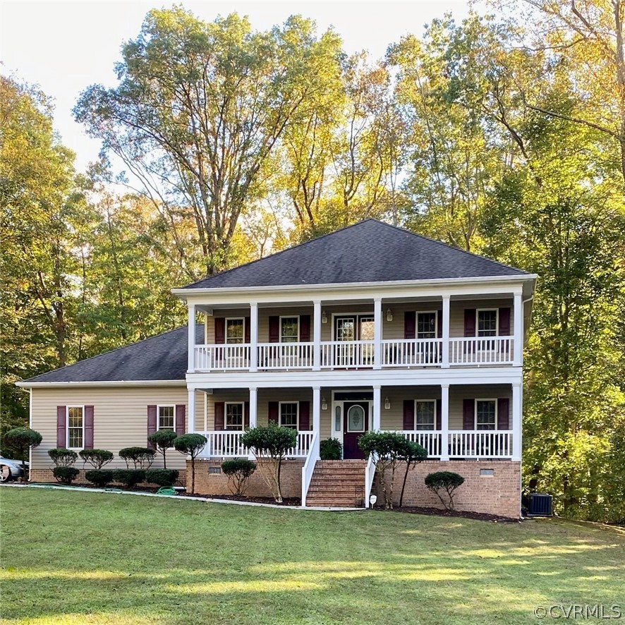 6153 Middle Road Prince George, VA 23875 - Photo 3 of 34 a front view of a house with a garden and trees