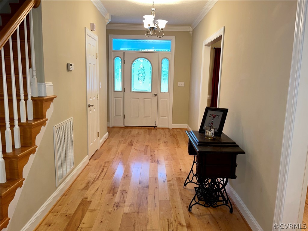 6153 Middle Road Prince George, VA 23875 - Photo 5 of 34 a view of a hallway with wooden floor and workspace