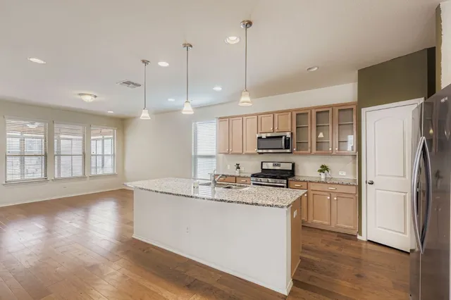 a view of kitchen with wooden floor