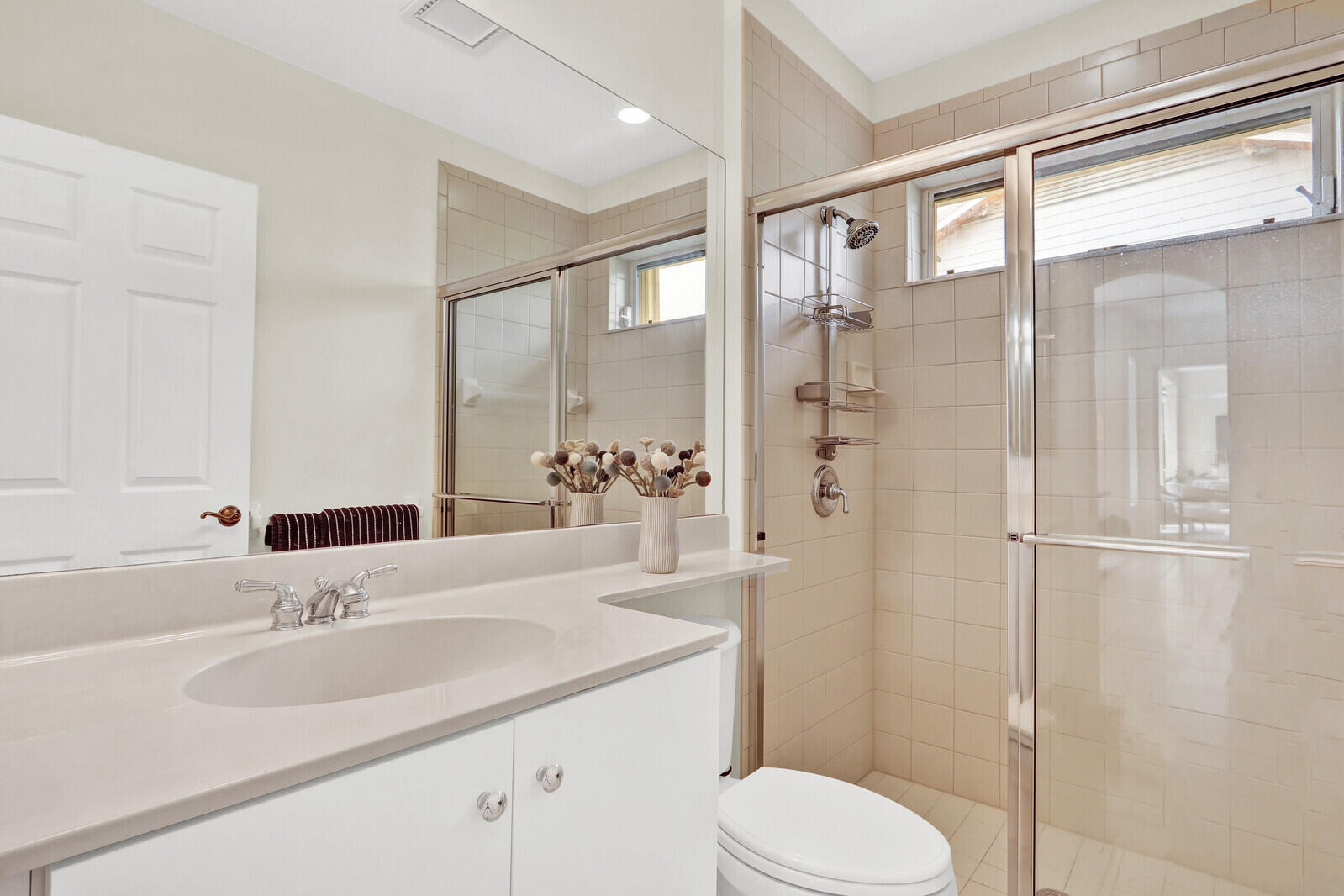 121 Olympus Way Jupiter, FL 33477 - Photo 12 of 13 a bathroom with a sink toilet and shower