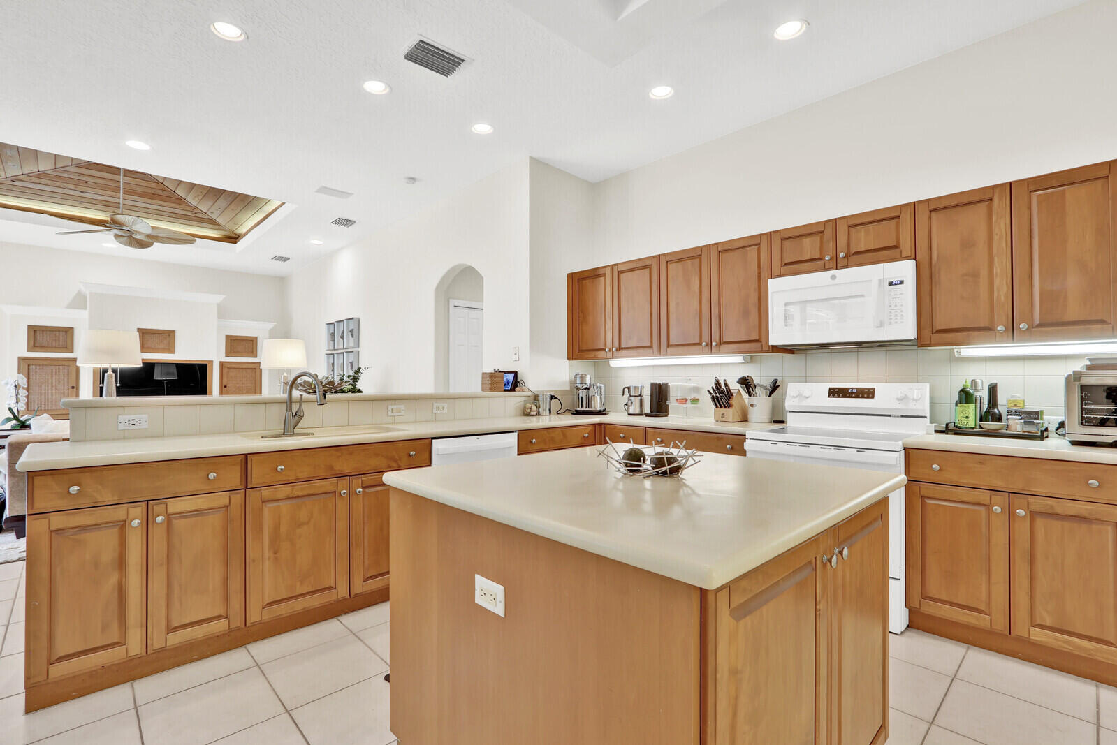 121 Olympus Way Jupiter, FL 33477 - Photo 7 of 13 a kitchen with a sink cabinets and wooden floor