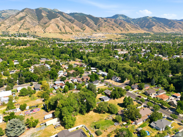 300 East S, Unit 2 Logan, UT 84321 - Photo 18 of 38 Expansive aerial perspective showcasing a residential area with varied rooflines and mature tree coverage